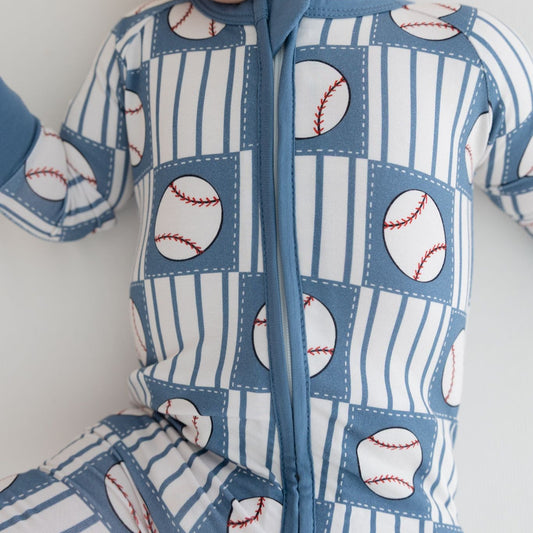 Baby onesie with baseball pattern on a white background