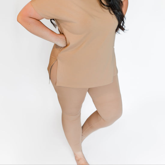 Woman model wearing tan leggings