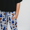 Close up photo of a short sleeve black t shirt, sports-themed design jogger pants with pockets on a white background featuring Duke University Basket ball, basket ball hoop, basket ball, Duke Jersey, Stars.